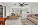 Comfortable living area with stylish tile floors, neutral decor, and plenty of natural light at 4231 Hollis Ave, Port Charlotte, FL 33953