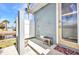 An outdoor shower area featuring a bench, shower head, and convenient access to a door at 4231 Hollis Ave, Port Charlotte, FL 33953