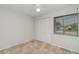 Bedroom featuring tile floor, ceiling fan, closet, and natural light at 4282 Pocatella Ave, North Port, FL 34287