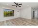 Inviting entryway featuring wood-look tile flooring, a modern ceiling fan, and bright natural light at 4282 Pocatella Ave, North Port, FL 34287