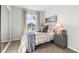 Serene bedroom with ample natural light, a comfortable bed, and neutral decor at 4911 Schubert Trl, North Port, FL 34287