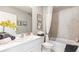 Bright bathroom featuring a single sink, white cabinets, and a shower-tub combination at 4967 Tuscola Blvd, North Port, FL 34287