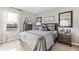 Comfortable bedroom features neutral tones, a large window, and stylish decor for a relaxing retreat at 4967 Tuscola Blvd, North Port, FL 34287