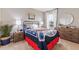 Baseball themed bedroom with large bed, baseball accents, natural light, and a dresser at 4967 Tuscola Blvd, North Port, FL 34287