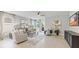 Spacious living room boasts neutral tones, comfortable seating, and a view of the outdoor patio at 4967 Tuscola Blvd, North Port, FL 34287
