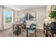 Stylish home office with natural light, a modern desk, and comfortable seating at 5028 Schubert Trl, North Port, FL 34287