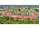Aerial view of the community showcasing manicured lawns, landscaping, and a golf course at 5046 San Rocco Ct, Punta Gorda, FL 33950