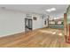 Large living room featuring hardwood floors, vaulted ceilings with a view into other living spaces at 5046 San Rocco Ct, Punta Gorda, FL 33950