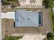 Overhead view of the house's layout, featuring the roof, driveway, and pool area at 7149 Sea Mist Dr, Port Charlotte, FL 33981