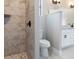 Beautiful bathroom features marble shower, toilet, and sink at 7149 Sea Mist Dr, Port Charlotte, FL 33981