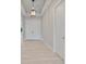 Bright entryway featuring double doors, tile flooring, and a hanging light fixture at 7149 Sea Mist Dr, Port Charlotte, FL 33981