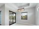 Bright living room with access to the outdoor pool area and backyard views at 7149 Sea Mist Dr, Port Charlotte, FL 33981