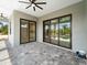 Outdoor patio with sliding glass doors that overlook the pool area at 7149 Sea Mist Dr, Port Charlotte, FL 33981