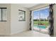 An open dining area with tile flooring and sliding doors leading to a screened pool at 7505 Carissa, Punta Gorda, FL 33955