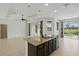 Updated kitchen with granite countertops, stainless steel appliances, kitchen island, and an eat-in breakfast bar at 7505 Carissa, Punta Gorda, FL 33955