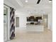 Open-concept kitchen has granite countertops, stainless steel appliances, a large island, and tile flooring at 7505 Carissa, Punta Gorda, FL 33955