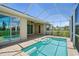 Covered patio area with brick pavers and access to pool, ideal for outdoor entertaining at 7505 Carissa, Punta Gorda, FL 33955