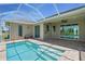 Covered patio area with brick pavers and access to pool, ideal for outdoor entertaining at 7505 Carissa, Punta Gorda, FL 33955