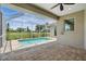 Screened-in pool area with brick pavers and view of the expansive, well-maintained yard at 7505 Carissa, Punta Gorda, FL 33955