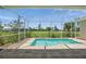 Screened-in pool area with brick pavers and view of the expansive, well-maintained yard at 7505 Carissa, Punta Gorda, FL 33955