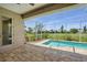 Screened-in pool area with brick pavers and view of the expansive, well-maintained yard at 7505 Carissa, Punta Gorda, FL 33955