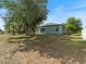 The backyard offers ample green space and natural light at 8849 Attalla Ave, North Port, FL 34287