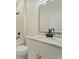 This bathroom features a white vanity, a toilet, and a shower tub at 8849 Attalla Ave, North Port, FL 34287