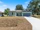 Exterior view of the home displaying the front yard and driveway at 8849 Attalla Ave, North Port, FL 34287