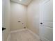 This laundry room features light-colored flooring and white walls at 8849 Attalla Ave, North Port, FL 34287