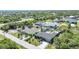 Desirable neighborhood aerial view highlighting the lush landscaping and proximity to community amenities at 9295 Melody Cir, Port Charlotte, FL 33981