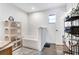 Bright bathroom featuring a soaking tub and decorative shelving at 9295 Melody Cir, Port Charlotte, FL 33981