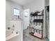 Bathroom featuring a tub and decorative shelves at 9295 Melody Cir, Port Charlotte, FL 33981