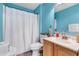 Bright blue bathroom features a shower/tub combination and tile flooring at 9295 Melody Cir, Port Charlotte, FL 33981