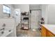 Bathroom featuring a tub, shower, and decorative shelves at 9295 Melody Cir, Port Charlotte, FL 33981