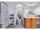 Bathroom with arched doorways leading to bedroom and vanity at 9295 Melody Cir, Port Charlotte, FL 33981