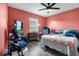 Bedroom features a large window, desk and an armchair next to the bed at 9295 Melody Cir, Port Charlotte, FL 33981