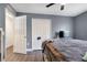 Bedroom features hard wood floors, ceiling fan, closet space and a TV at 9295 Melody Cir, Port Charlotte, FL 33981