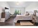 Bedroom featuring a cozy bed, dresser, and window with natural light at 9295 Melody Cir, Port Charlotte, FL 33981