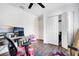 Bedroom with white walls, closet, office chair, desk, and laminate floors at 9295 Melody Cir, Port Charlotte, FL 33981
