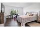 Bright bedroom with natural light, a queen bed, and an area rug at 9295 Melody Cir, Port Charlotte, FL 33981