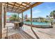 Back deck featuring an above ground pool and seating area at 9295 Melody Cir, Port Charlotte, FL 33981