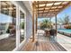 Back deck featuring a pool and seating area at 9295 Melody Cir, Port Charlotte, FL 33981