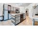 Modern kitchen with updated appliances, center island, and lots of counter space at 9295 Melody Cir, Port Charlotte, FL 33981