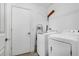 Functional laundry room features a washer and dryer for convenient chores at 9295 Melody Cir, Port Charlotte, FL 33981