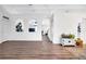 Open concept living space with hardwood floors, neutral walls and archways to other rooms at 9295 Melody Cir, Port Charlotte, FL 33981