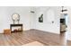 Bright and airy living room featuring hardwood floors, neutral walls and archways to other rooms at 9295 Melody Cir, Port Charlotte, FL 33981