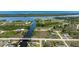 Expansive aerial view of waterfront community with private canals, nearby bay access, and lush landscaping at 10233 St Paul Dr, Port Charlotte, FL 33981