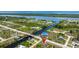 Waterfront community aerial showcasing private canals, bay access, and lush landscaping surrounding homes at 10233 St Paul Dr, Port Charlotte, FL 33981