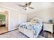 Stylish bedroom with a ceiling fan and a view into another room at 10233 St Paul Dr, Port Charlotte, FL 33981