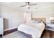 A cozy bedroom with a wicker bed frame, ceiling fan, and plenty of room at 10233 St Paul Dr, Port Charlotte, FL 33981
